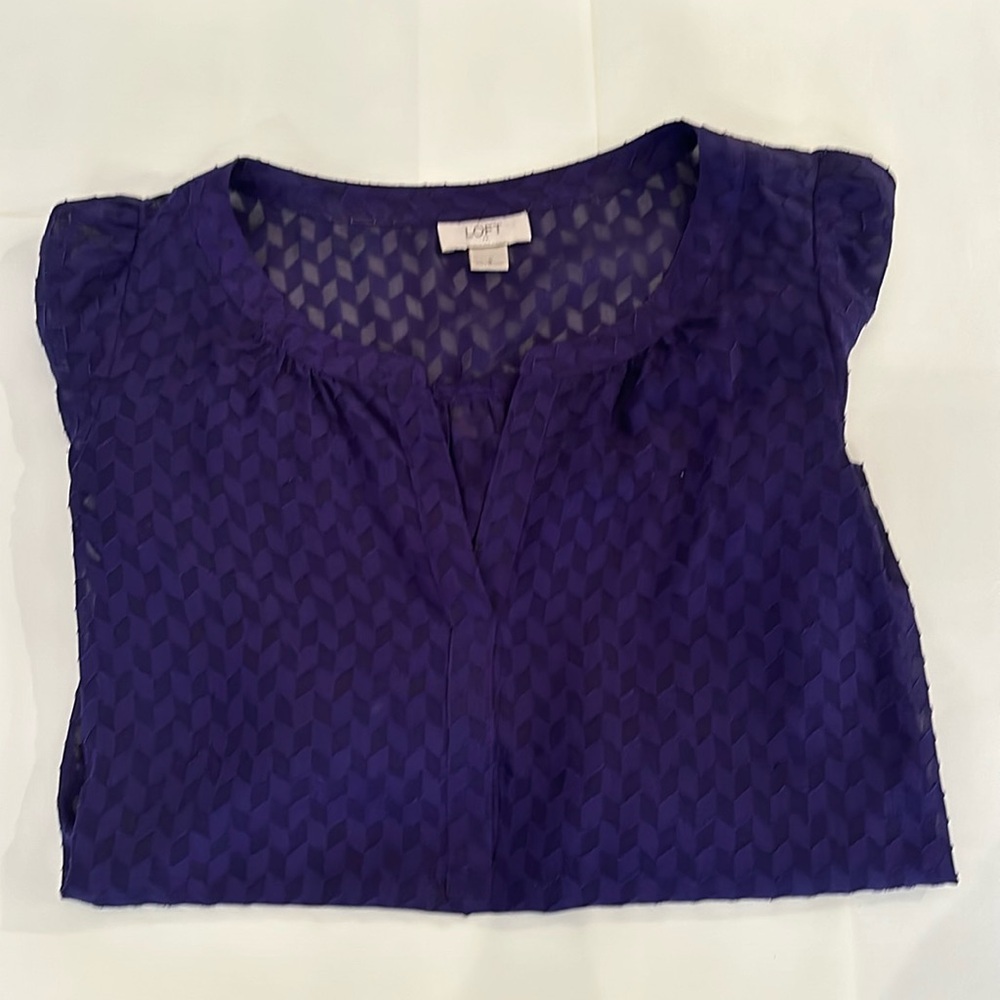 Three quarter length purple blouse
